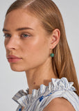 Model wearing MEGAN PARK Green Onyx Drop Earrings featuring polished green gemstone spheres on fine gold hooks.
